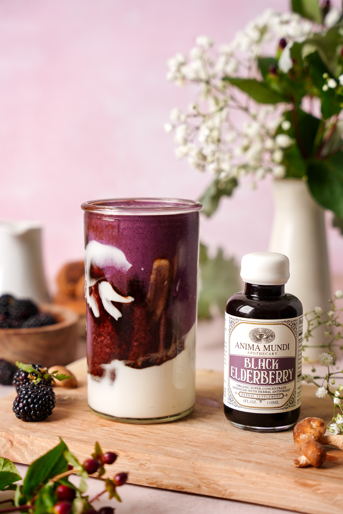 the healthy elderberry smoothie next to the anima mundi elixir