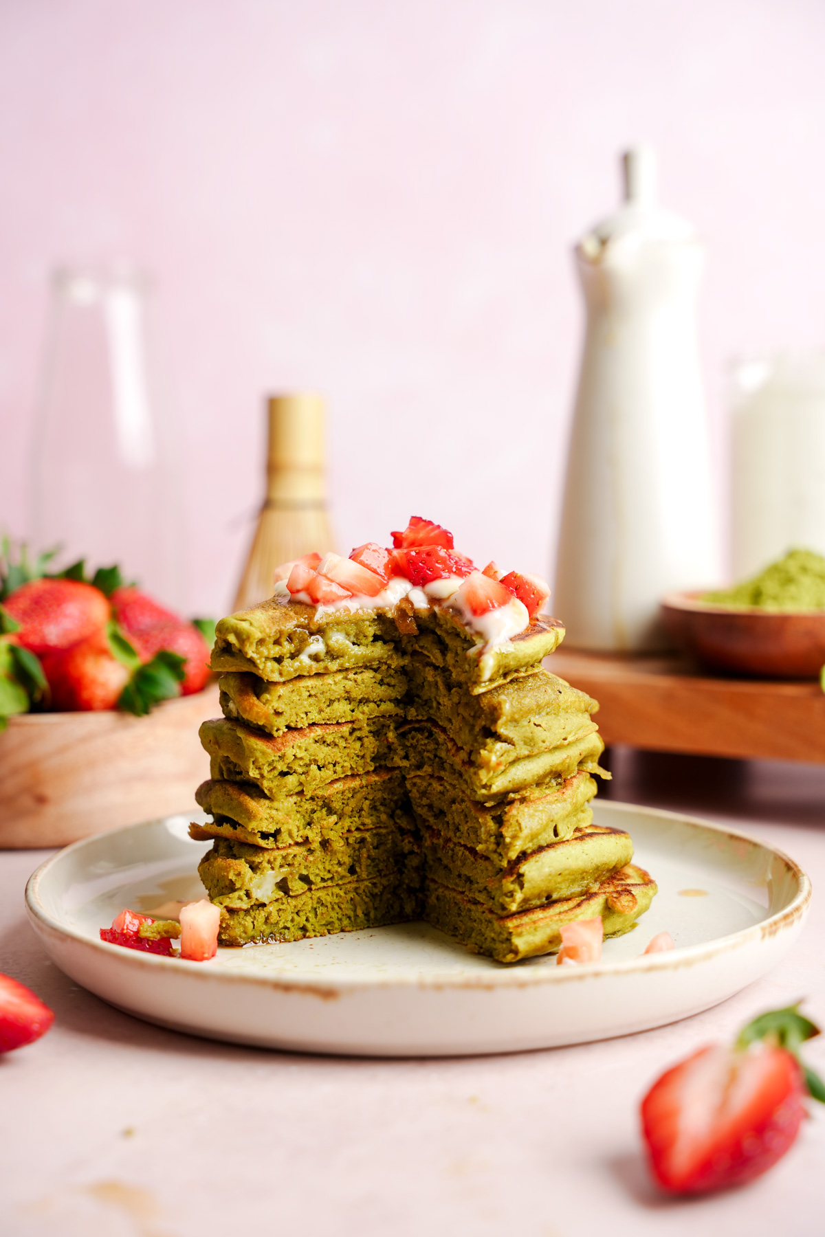 the vegan matcha pancakes cut open to show the fluffy texture