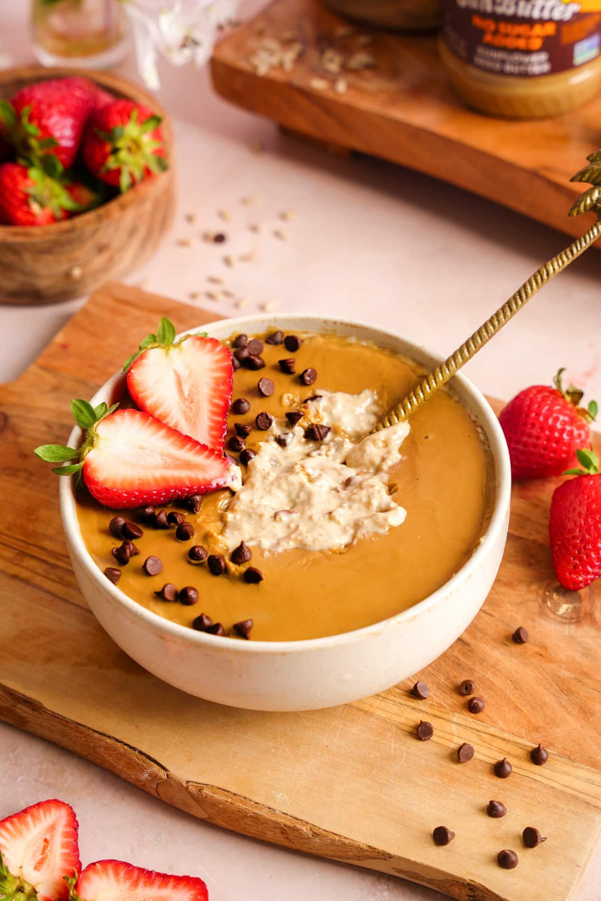 the blended oats with a spoon broken into it to show the creamy texture of the blended oats